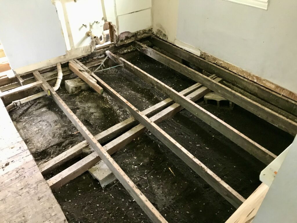 dirt exposed under the flooring