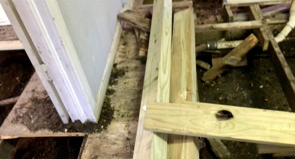 new wood beams for foundation repairs in small fixer upper