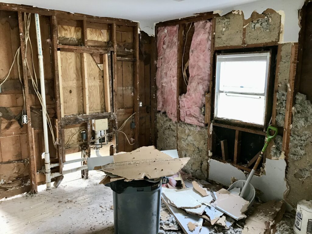 drywall ripped out and insulation exposed