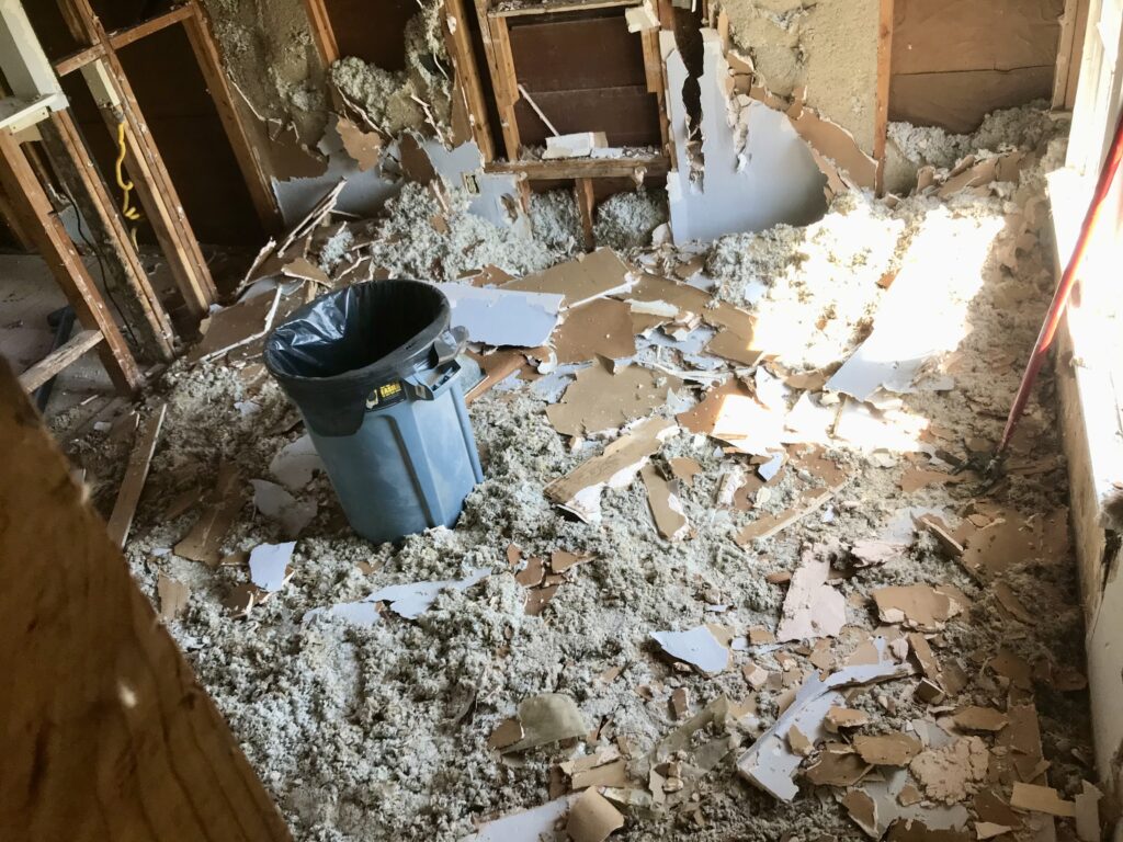 drywall and insulation pieces all over the floor