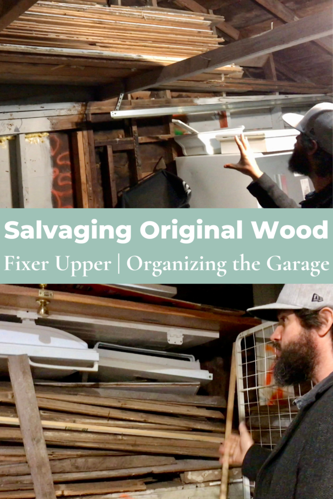 man looking at old original salvaged wood stacked up in garage 