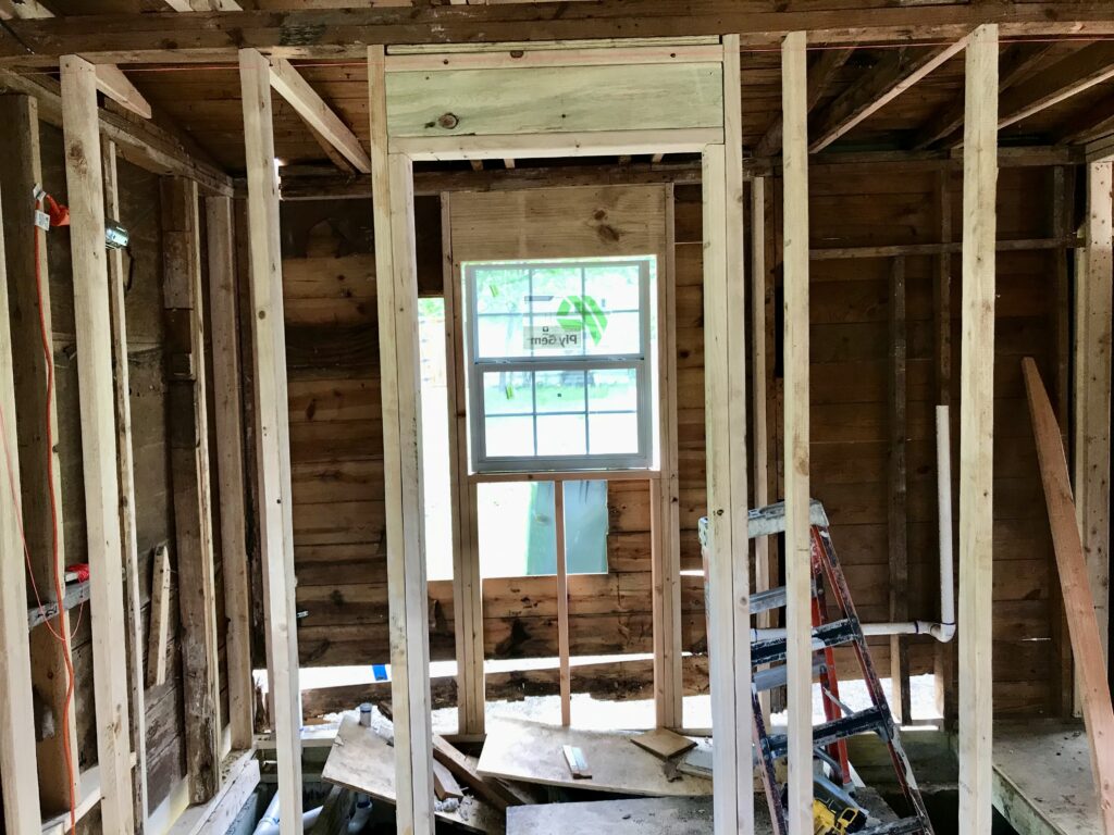 bathroom wall frame with window in the middle