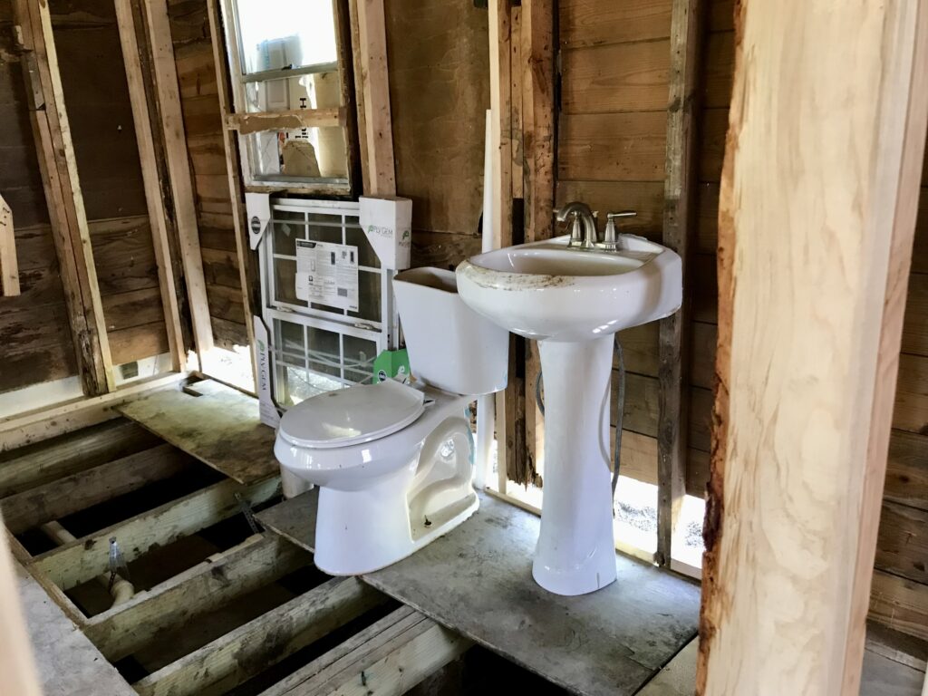 window, toilet, and sink for bathroom renovation design