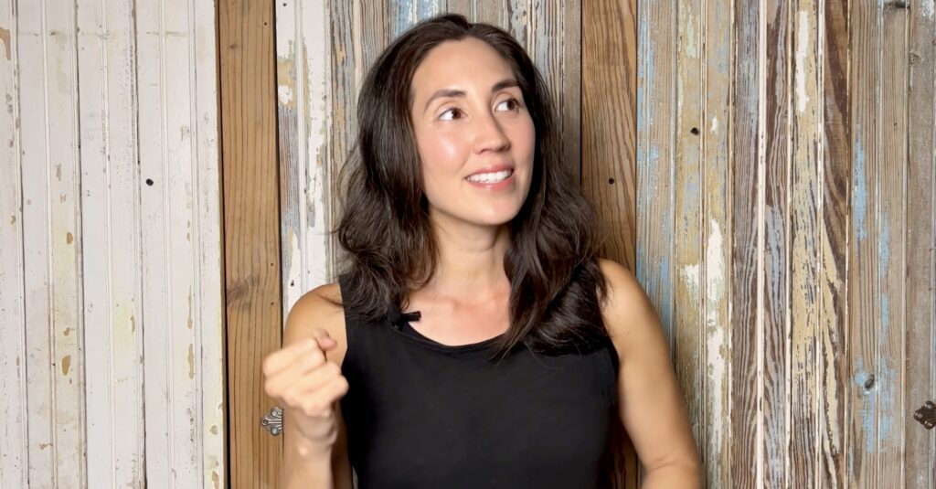 woman making a gesture with fist to show excitement 