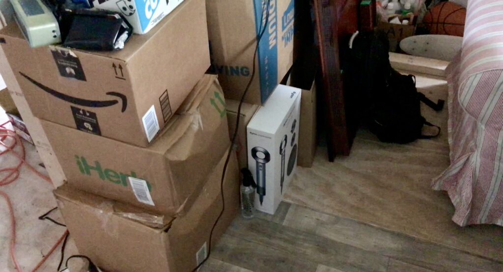moving boxes stacked in bedroom