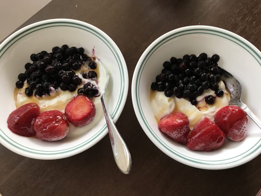 yogurt with blueberries, strawberries, and honey