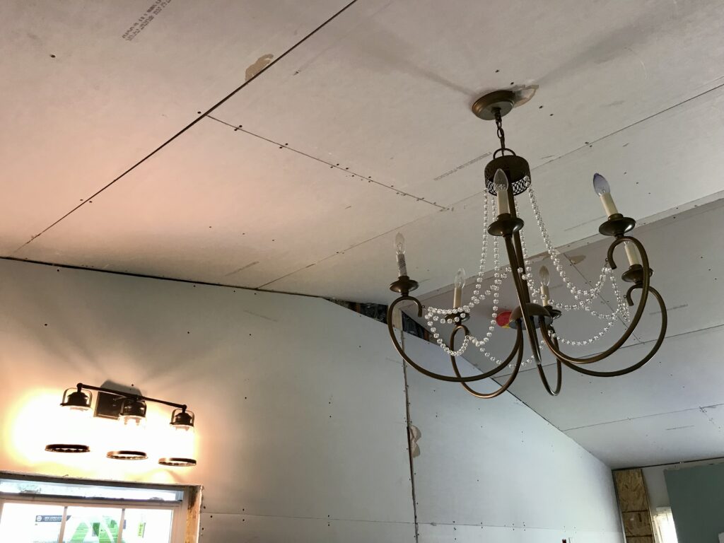 light fixtures hanging from drywall