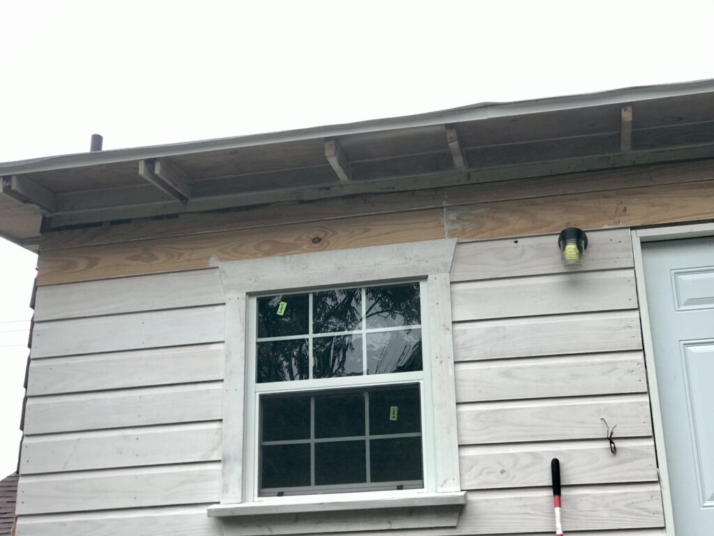 old original cottage siding and rafter tails